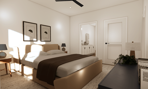 A bedroom with a large bed and a ceiling fan.