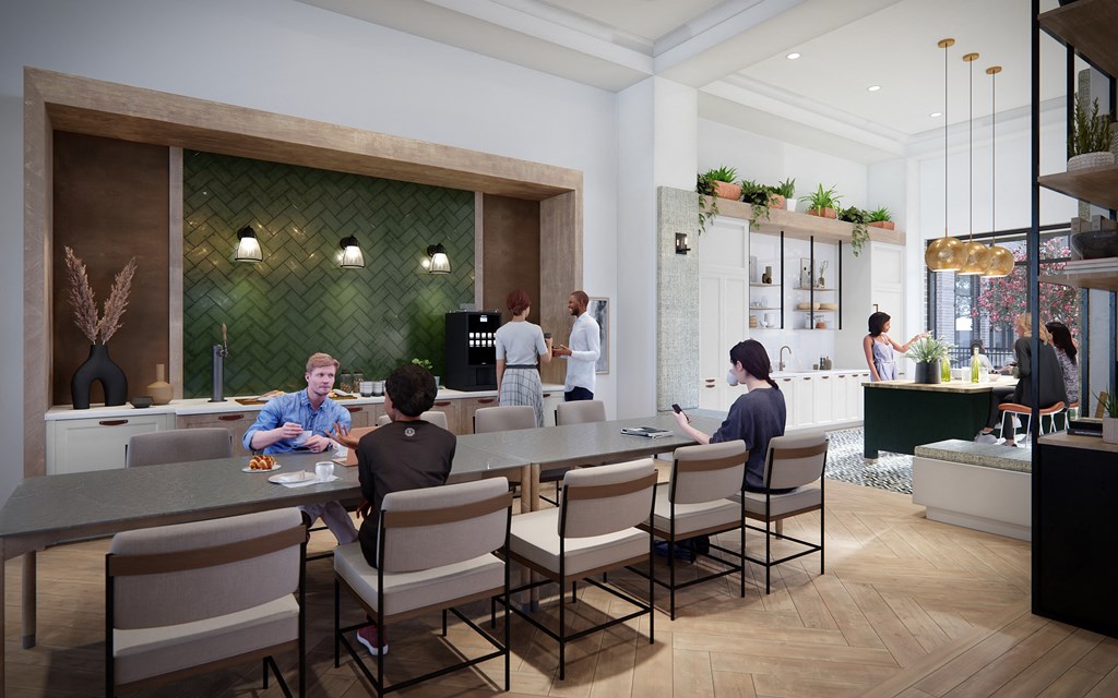 A group of people are sitting at a table in a restaurant.