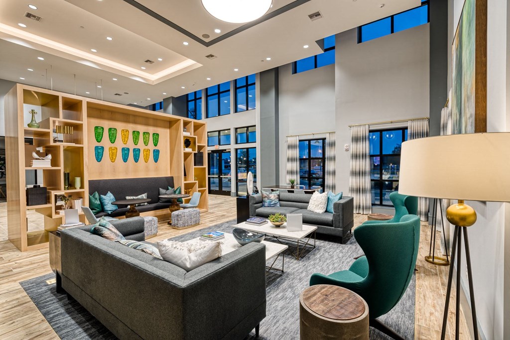 a living room with couches and chairs and a fireplace