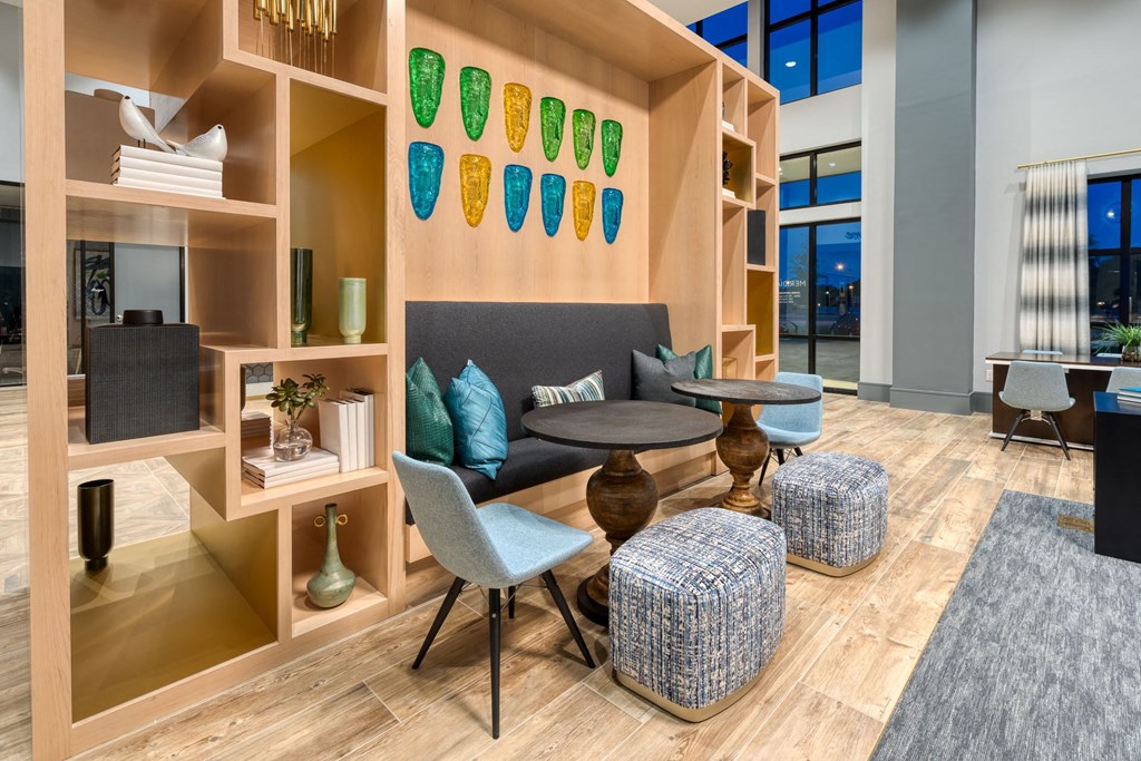 a living room with a couch and tables