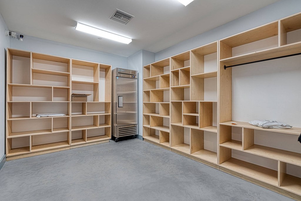 a room with shelves and a whiteboard