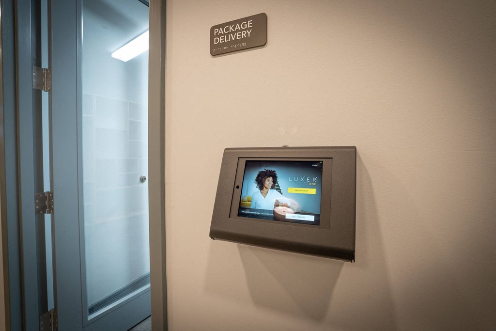 a television on the wall in a room with a door