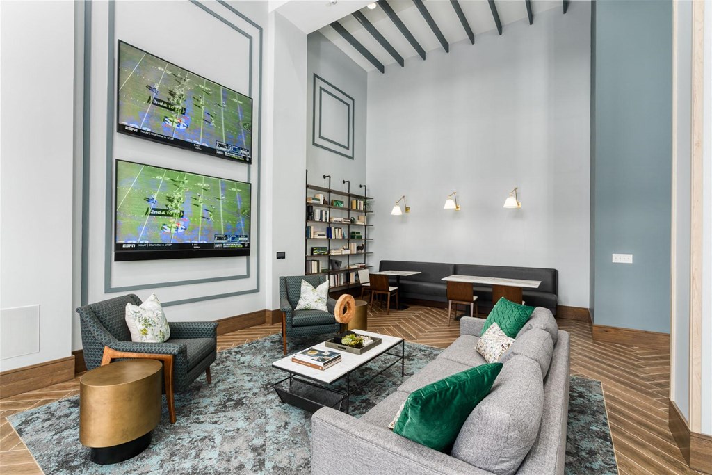 a living room with couches and a tv