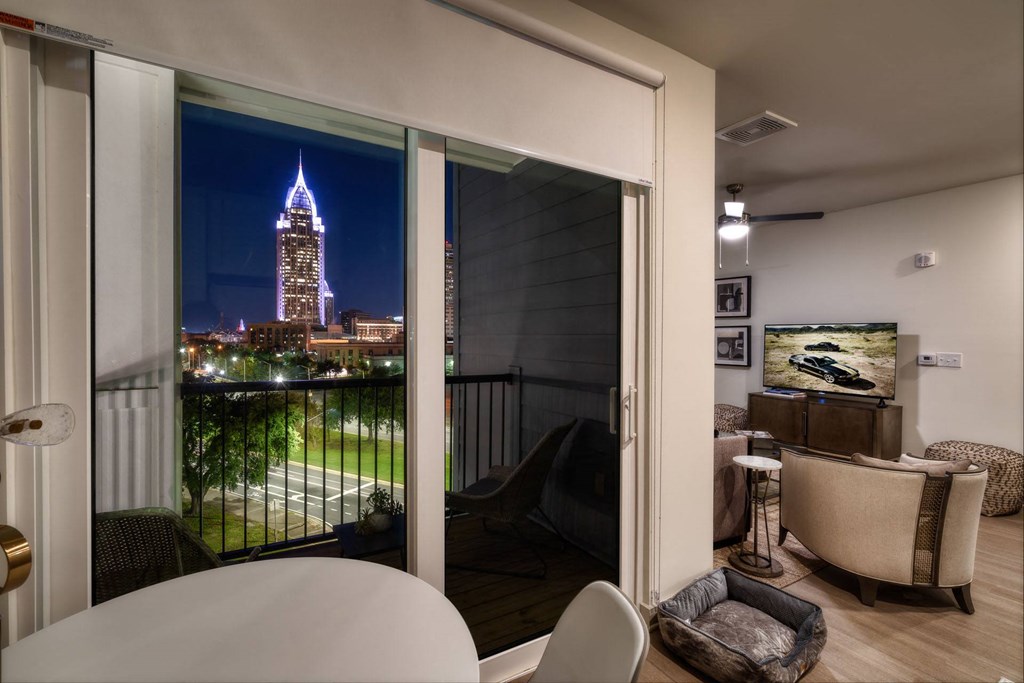 a view of the empire state building from a balcony of a living room