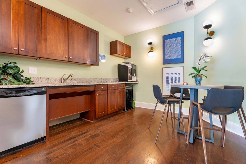 a kitchen and dining room with a table and chairs