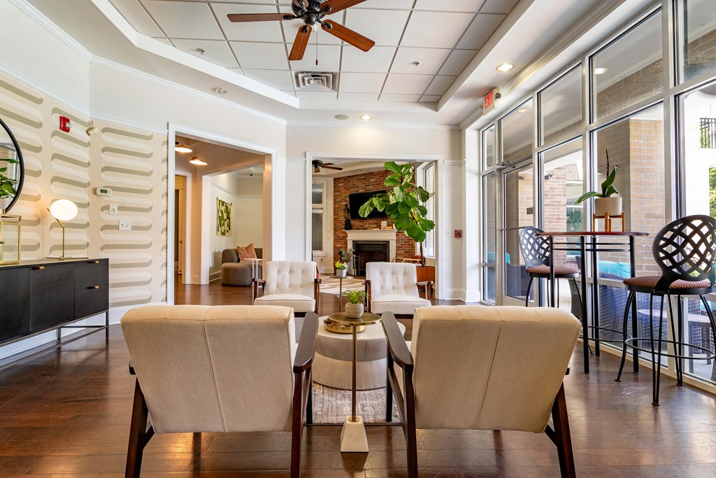 a living room with a table and chairs and a fireplace
