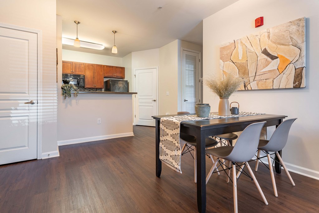 a kitchen and dining room with a table and chairs