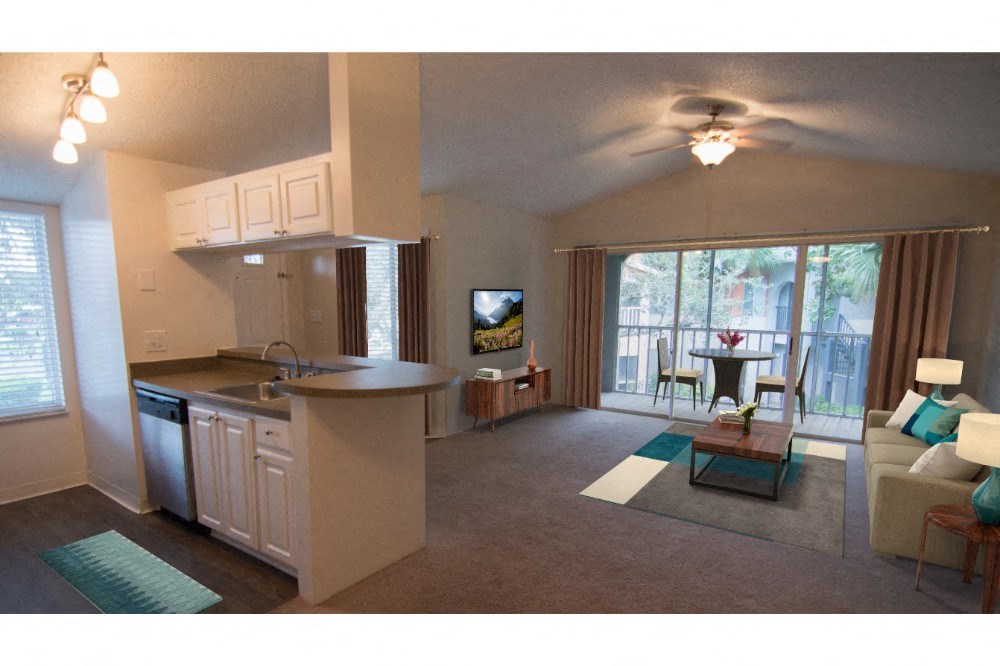 a spacious living room with a kitchen and a balcony