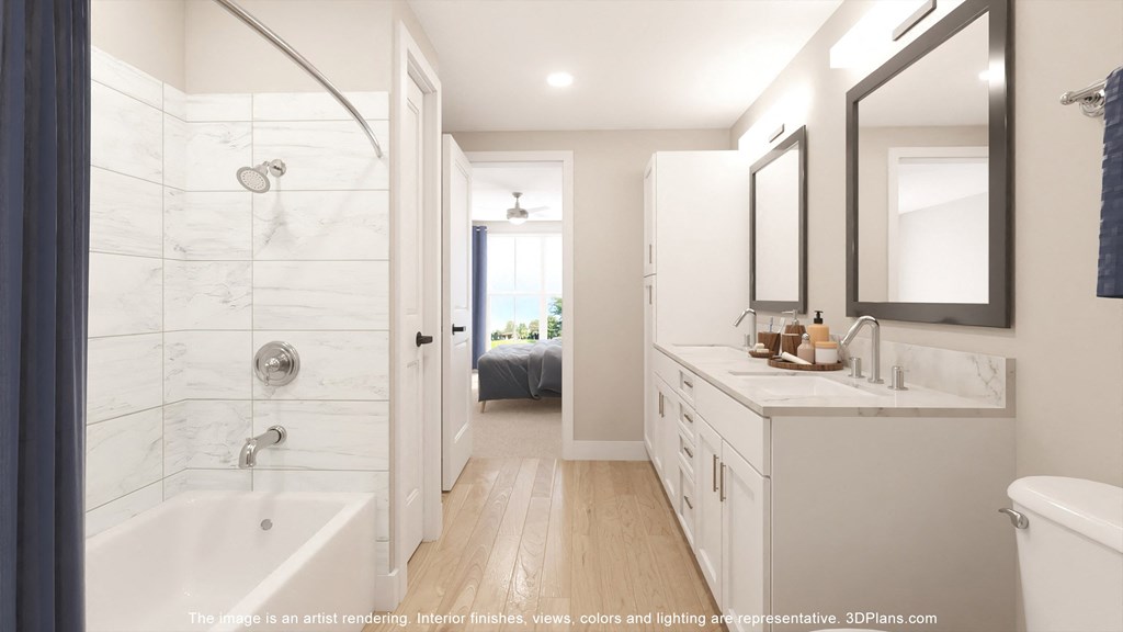 a bathroom with a tub and a sink and a shower