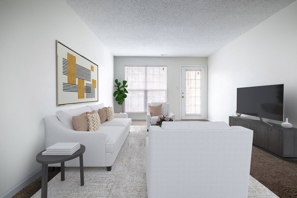 a living room with a white couch and a tv