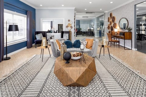A modern living room with a wooden coffee table in the center.