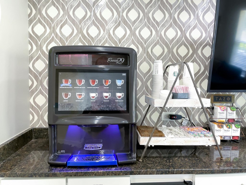 a coffee machine sitting on top of a kitchen counter