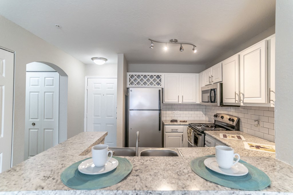 Kitchen at Mission Club Apartments in Orlando, FL Kitchen at Mission Club Apartments in Orlando, FL