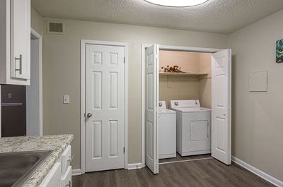 Model Unit Laundry Room at The Avenues at Holcomb Bridge in Peach Tree Corners, GA