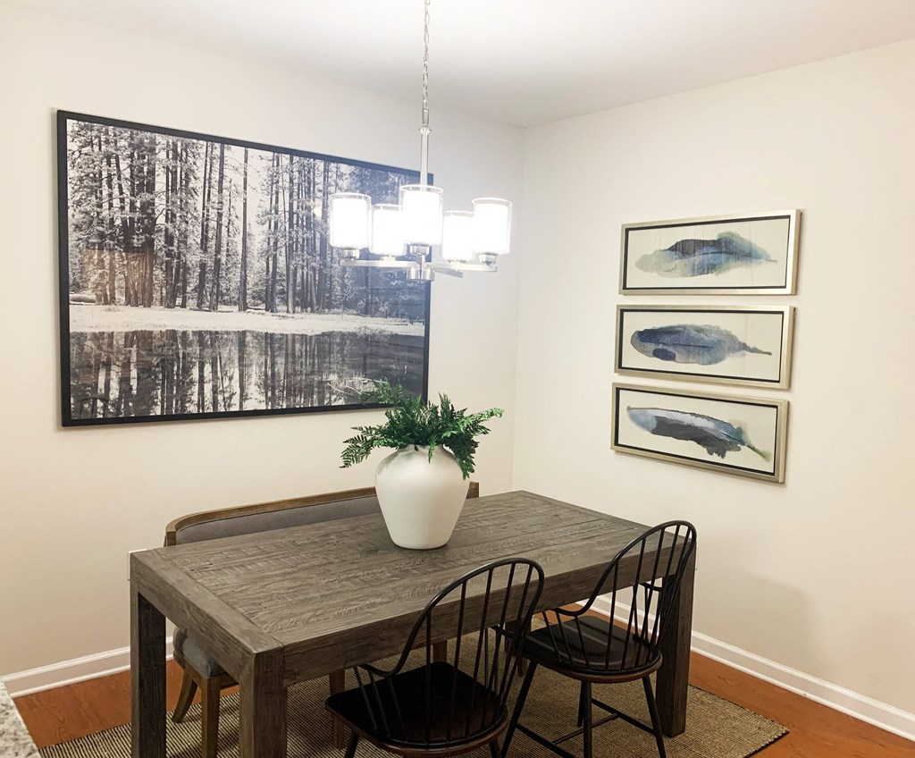 Home Interior a dining room with a table and chairs