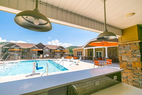 A swimming pool with seating areas.