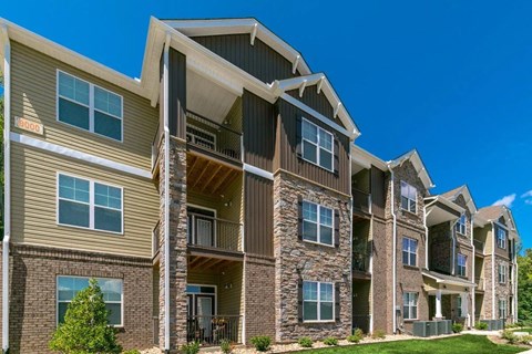 Exterior of complex with windows and balconies.