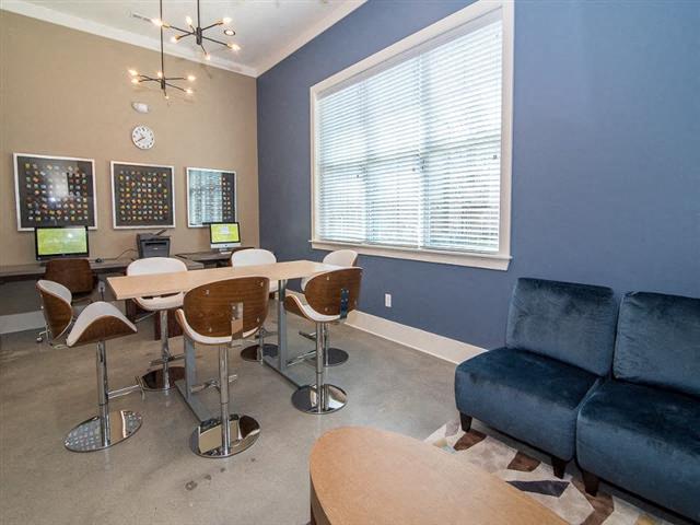 a living room with a table and a couch