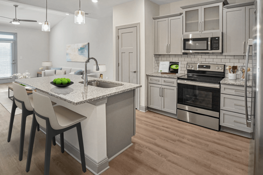 a kitchen with an island and a table with chairs