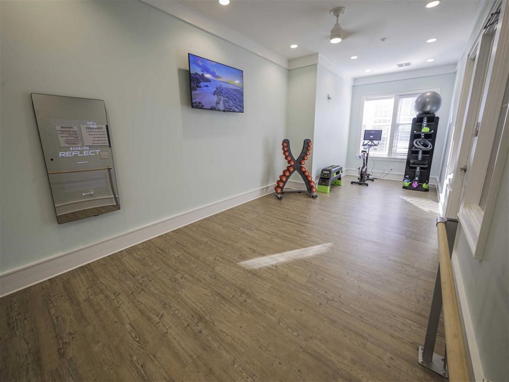 a living room with a hard wood floor and