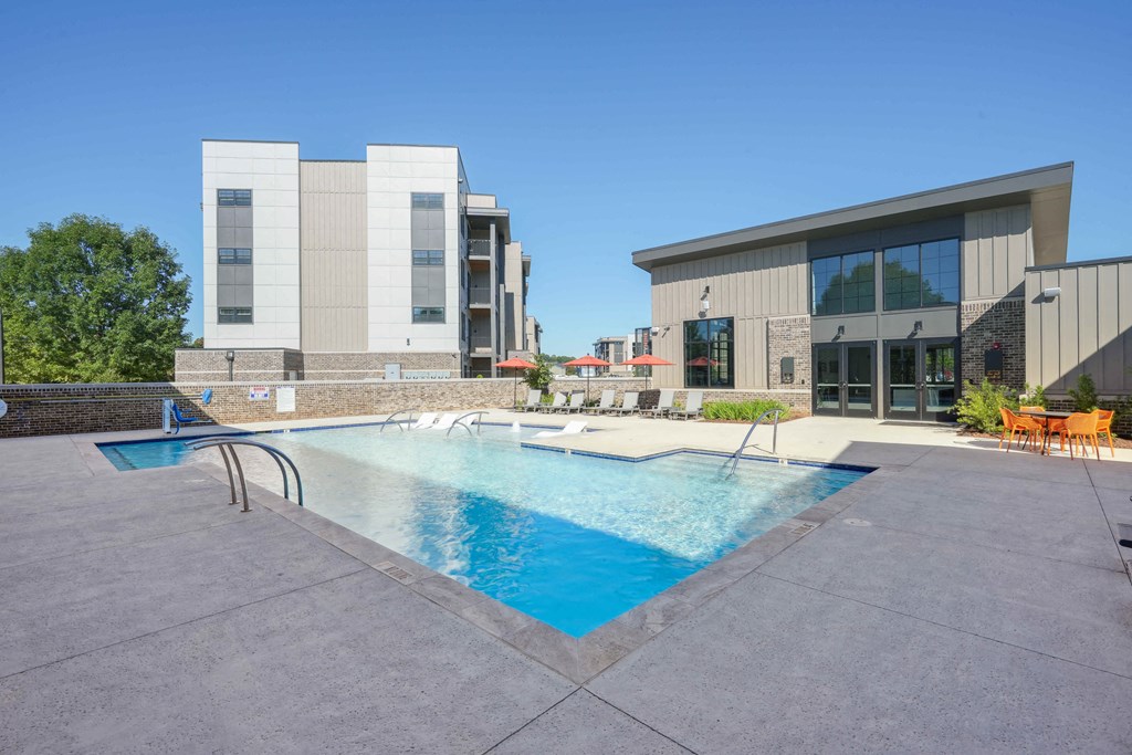 a swimming pool in front of a building