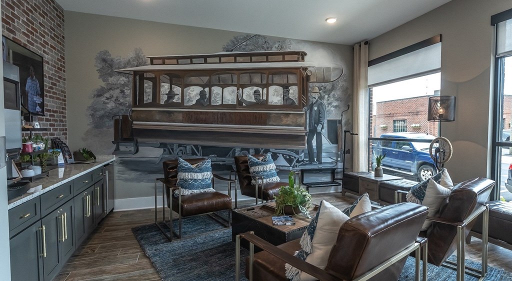 a living room with a piano and a large window