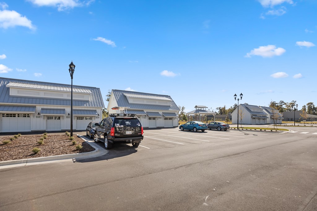 Parking lot with cars parked in parking spaces.