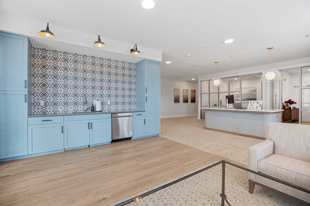 Clubhouse Kitchen with Blue Cabinets and a Patterned Backsplash.
