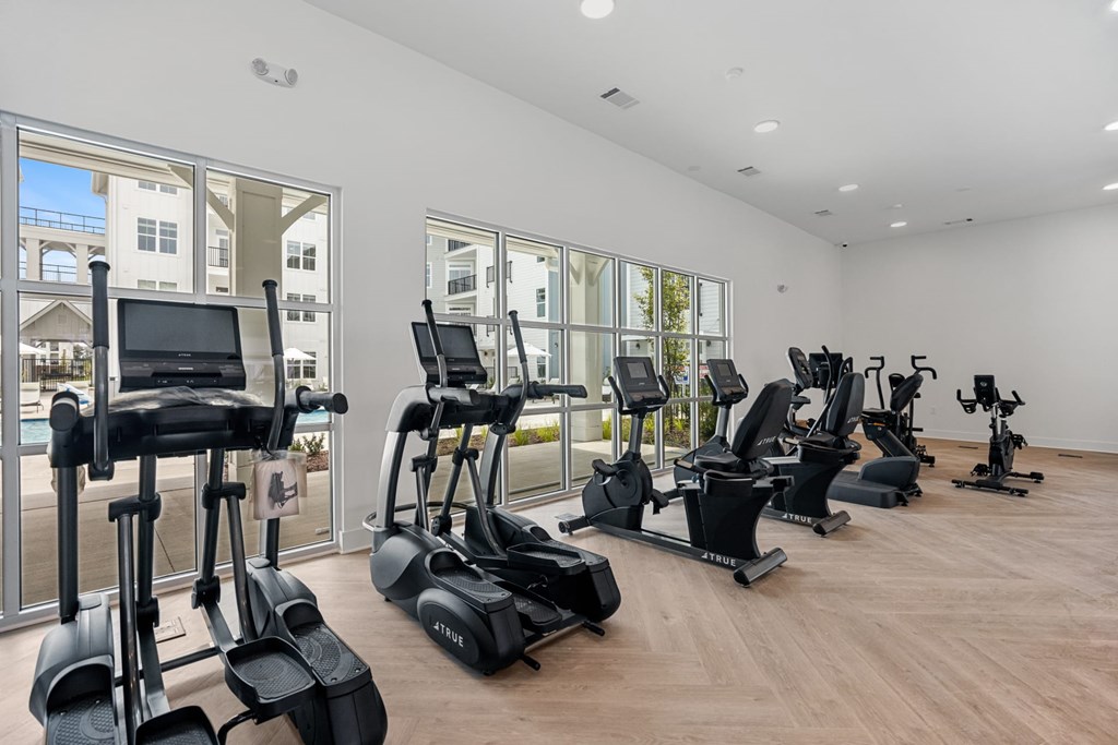 A Gym with a Row of Exercise Bike For Use.