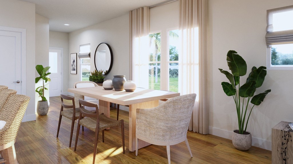 a dining room with a table and chairs and a window