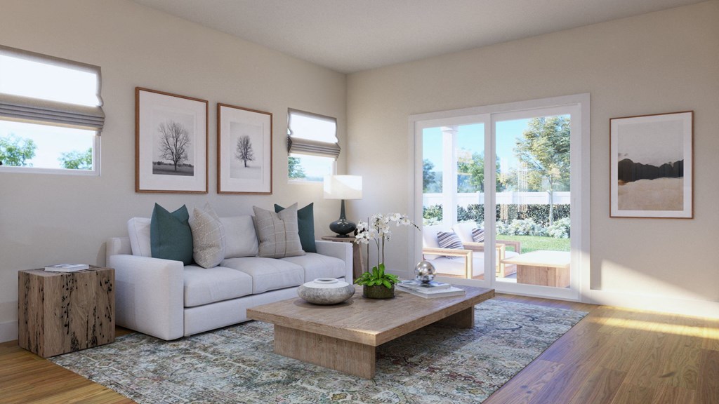 a living room with a white couch and a coffee table