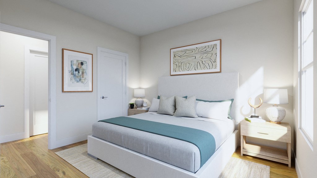 a bedroom with a bed and a door to a closet