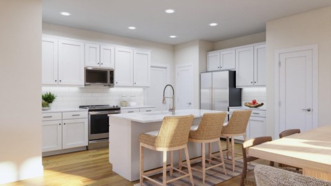 a kitchen with white cabinets and a large island with chairs