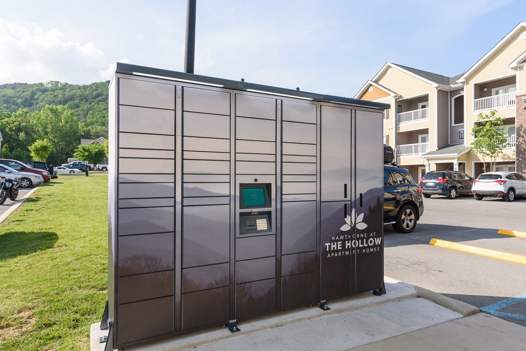 a small building with a parking meter on the side of a street