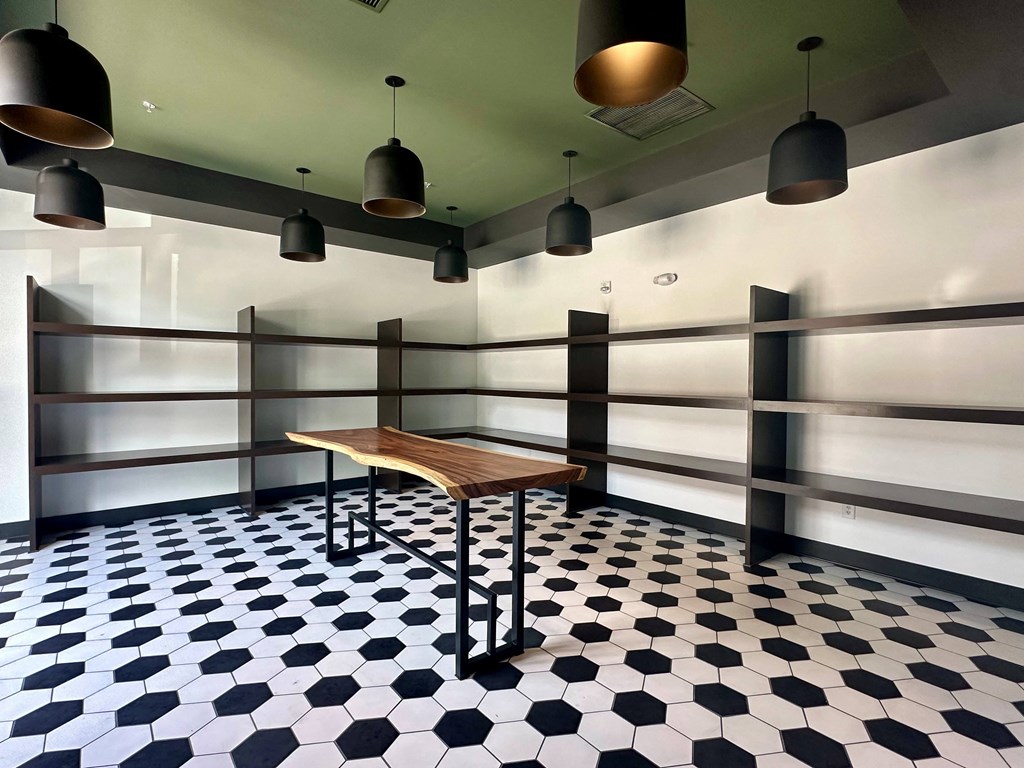a small table in a room with a black and white checkered floor
