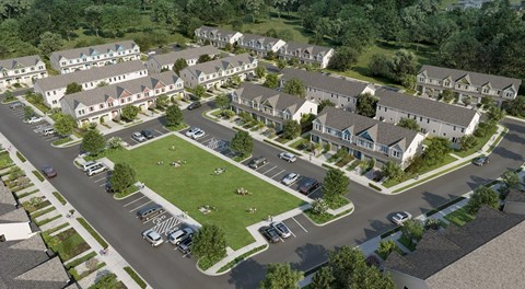 A large, well-maintained apartment complex with a green lawn and multiple buildings.