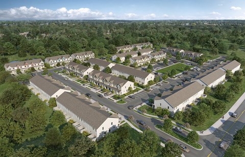 An aerial view of a residential area with houses and a church.