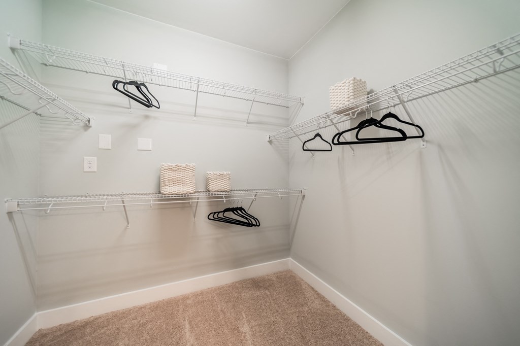 our spacious closets are stocked with shoes and bags in our spacious walk in closet