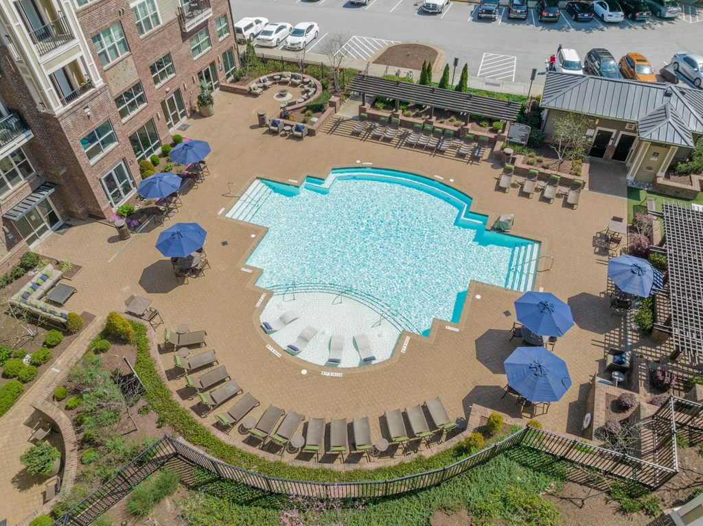 a large swimming pool in front of a building