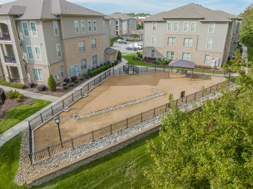 an aerial view of an empty playground in an apartment complex