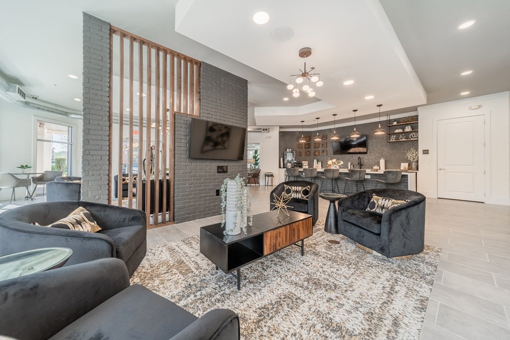 a living room filled with furniture and a large window