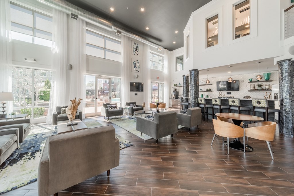 a living room with couches and chairs and a fireplace