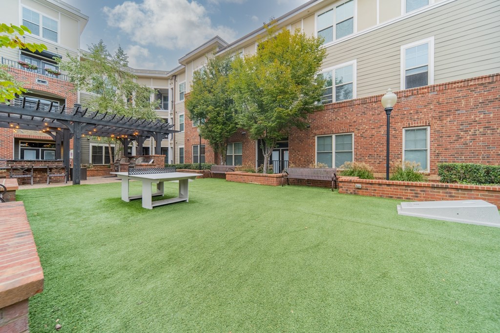 our apartments have a large backyard with a picnic table