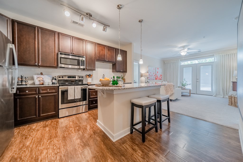 a kitchen and living room in a 555 waverly unit