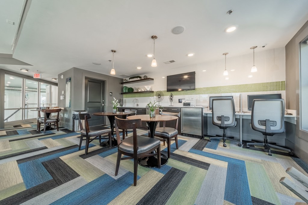 the reserve at bucklin hill clubhouse resident lounge with tables and chairs
