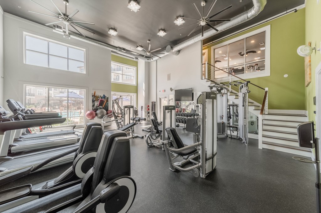 a gym with treadmills and other exercise equipment