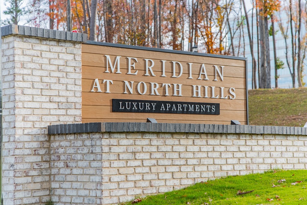 A sign for Meridian at North Hills Luxury Apartments is displayed.