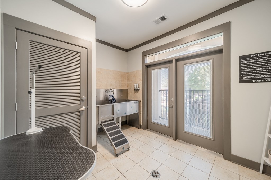 a wet room with a shower and a sink