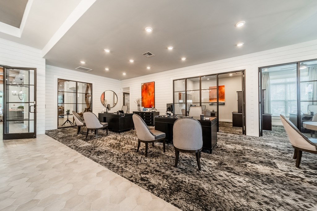 a living room with a table and chairs and sliding glass doors