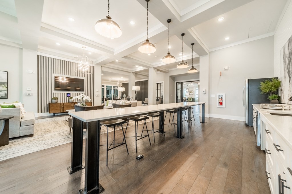 a large kitchen with a long island with bar stools